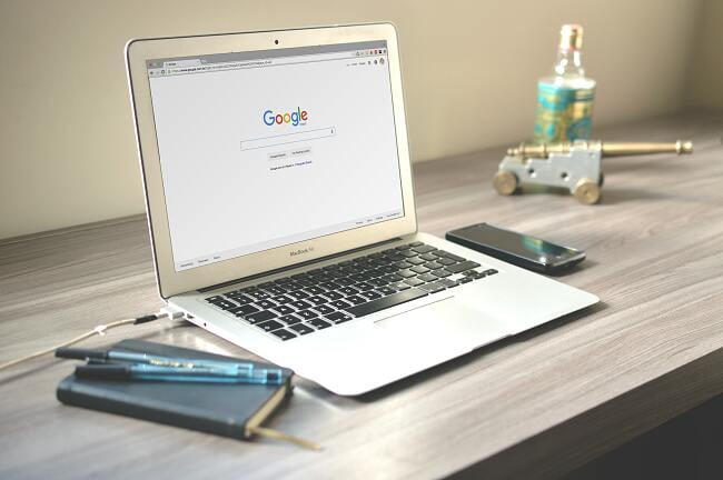 Photos of laptop opening a Google website