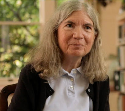 Screenshot of Carol Shaw smiling at the camera.