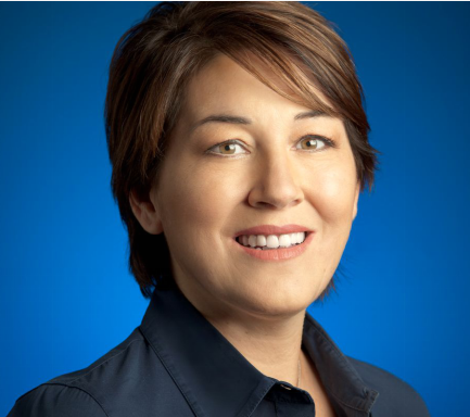 Portrait of Francoise Brougher smiling at the camera.