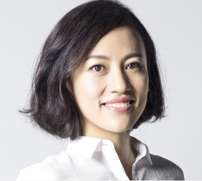 Studio portrait of Jean Liu smiling at the camera.