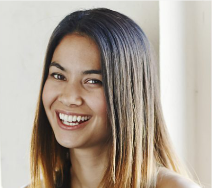 Portrait of Melanie Perkins smiling at the camera.