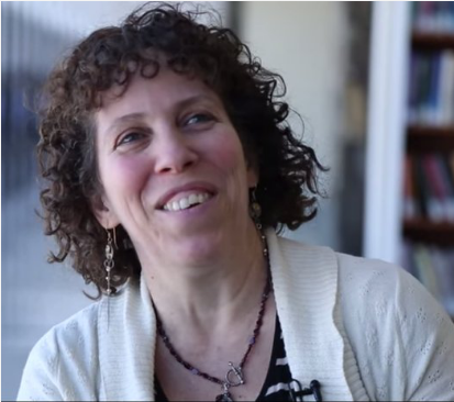 Photo of Tal Rabin in a library.