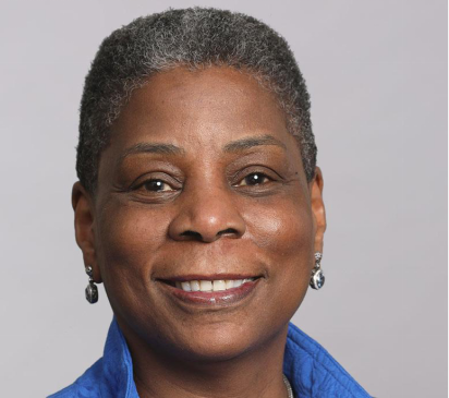 Portrait of Ursula Burns smiling at the camera.